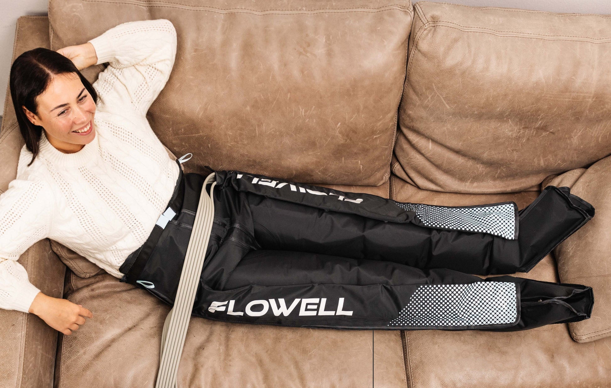 Flowell Essentials Bundle - woman wearing Flowell Home Pants Set on a couch