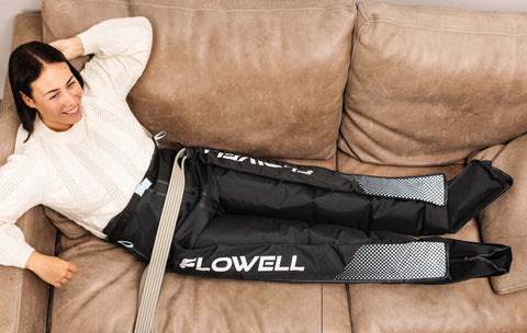 Flowell Essentials Bundle - woman wearing Flowell Home Pants Set on a couch