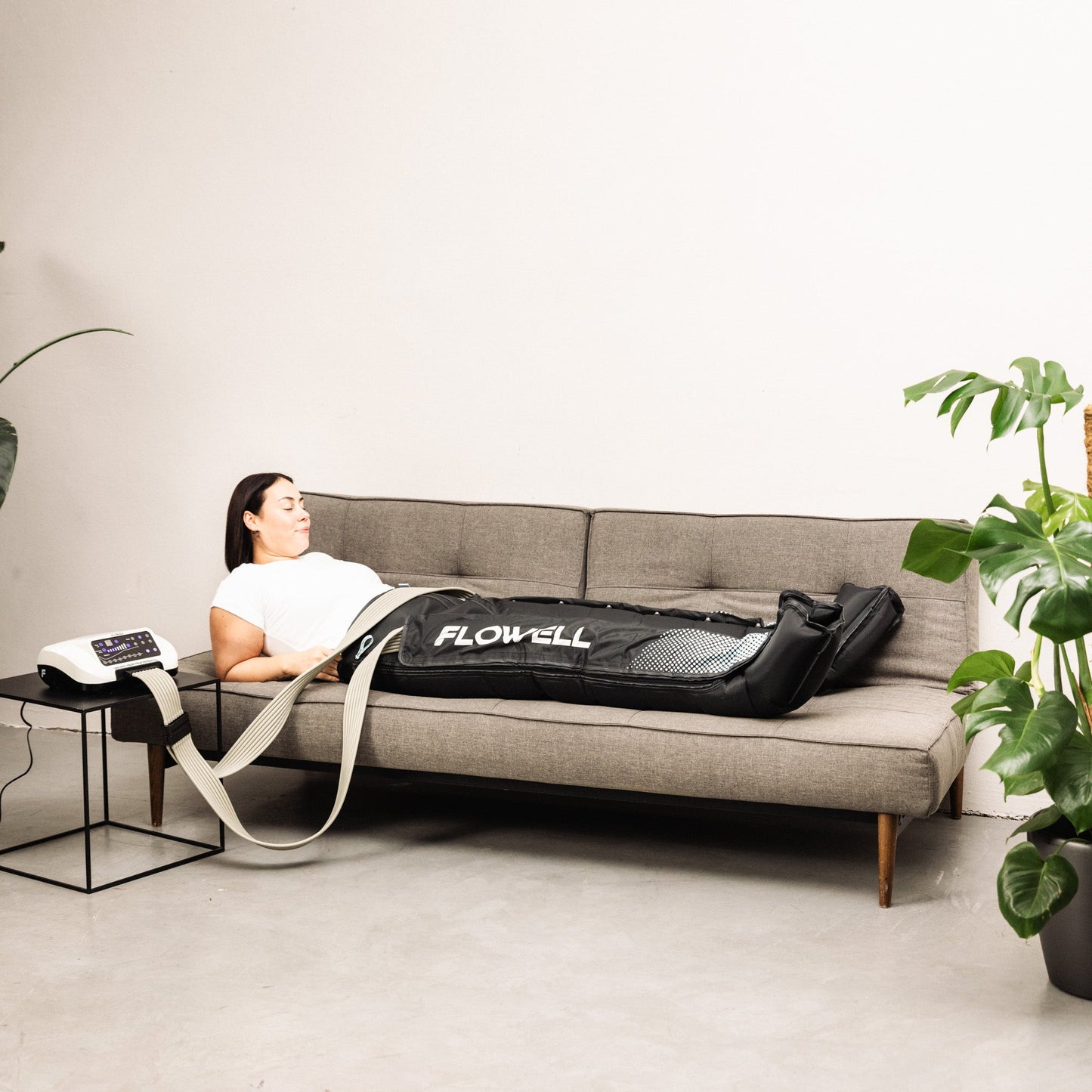Flowell Home Pants Set - Woman laying on couch wearing Flowell Home Pants Set in black and light blue. "Next level Lymphatic Drainage" - CNN