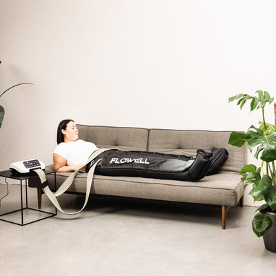 Flowell Home Pants Set - Woman laying on couch wearing Flowell Home Pants Set in black and light blue. "Next level Lymphatic Drainage" - CNN