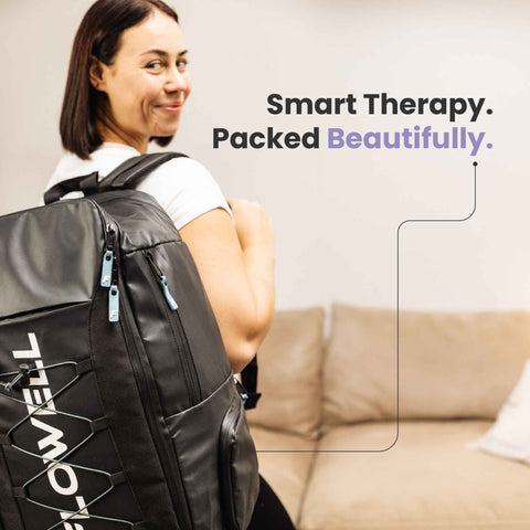 Flowell Prime Luxe Bundle - Woman wearing Flowell Pro Gear backpack in black and light blue. Smart therapy. Packed beautifully