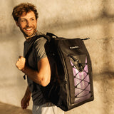 Flowell Pro Gear Backpack - Man wearing Pro Gear Backpack in black and purple over his shoulder