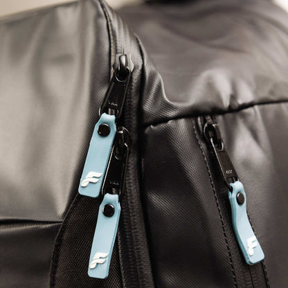 Flowell Pro Gear Backpack - Close up shot of Pro Gear Backpack's light blue and white zippers