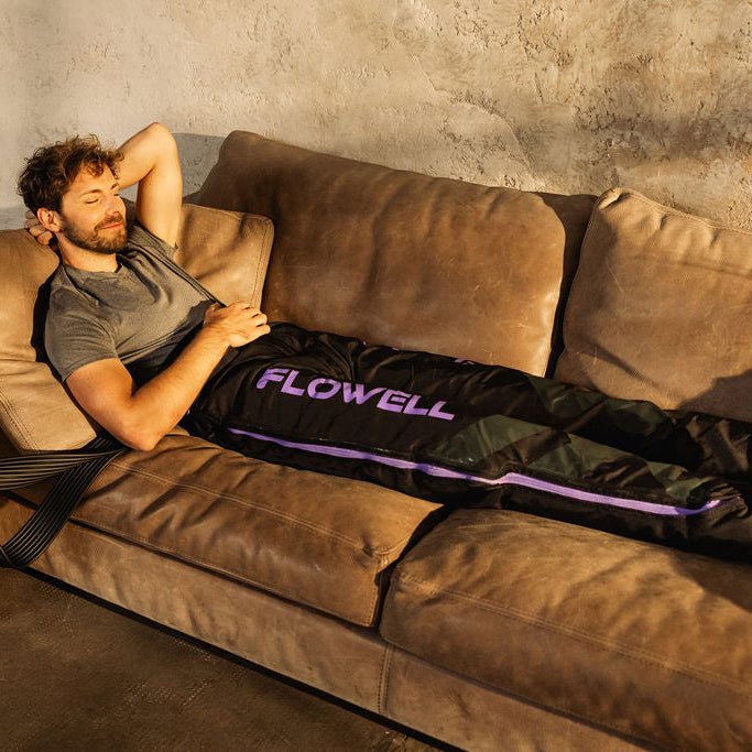 Flowell: Man lying on couch wearing his Sport Deluxe Pants Set