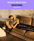Flowell Sport Deluxe Pants Set - Man laying on couch wearing Flowell Sport Deluxe Pants Set in black and purple. Sports Recovery Redefined With Flowell