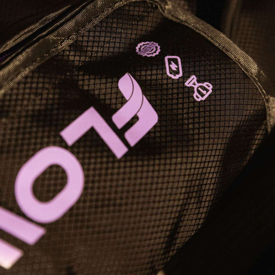Flowell Sport Mobile Boots Set - Close up shot of purple Flowell logo on black Mobile Boots Set