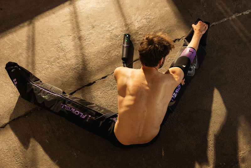 Flowell: Man stretching on the floor wearing his Flowell mobile boots